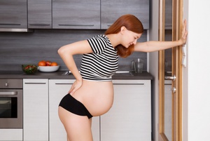 Болит спина при беременности во втором триместре